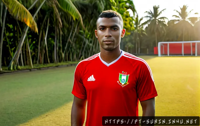 Home 17 수리남의 유명한 축구 선수와 스포츠 스타 - Photorealistic editorial sports portrait of a Surinamese male football star in a plain red training ...